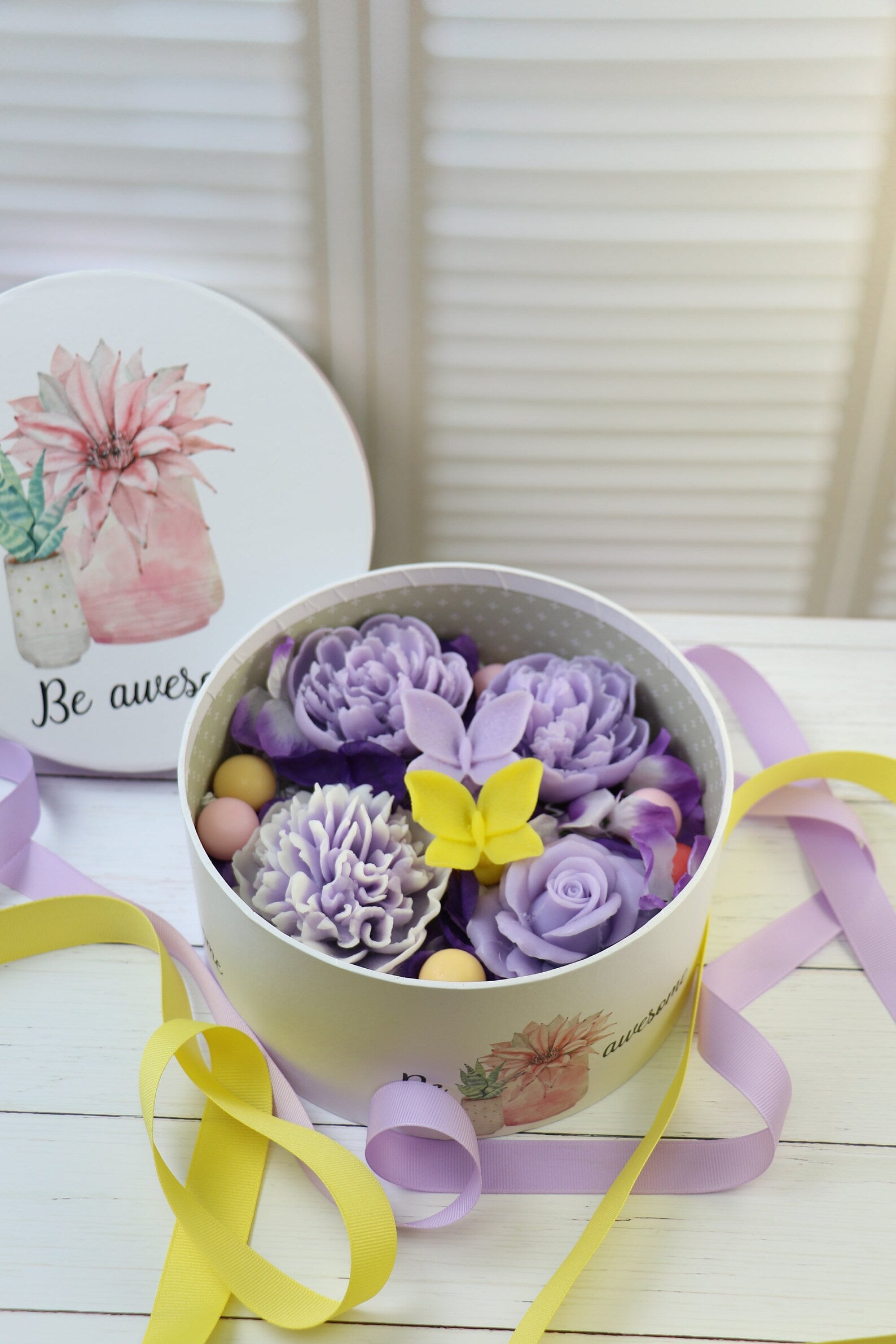 Purple soap flowers in the box with butterflies 