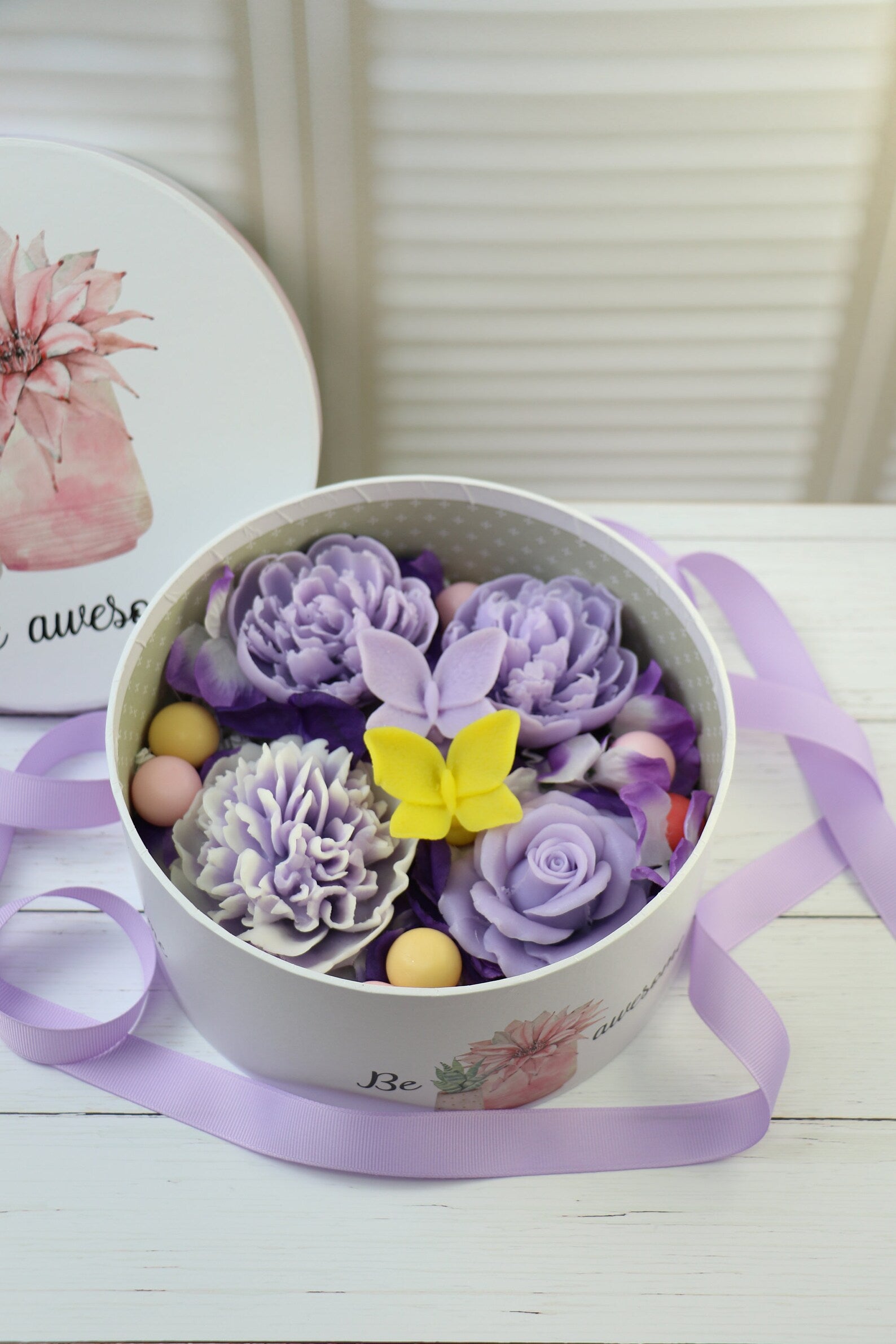 Purple soap flowers in the box with butterflies