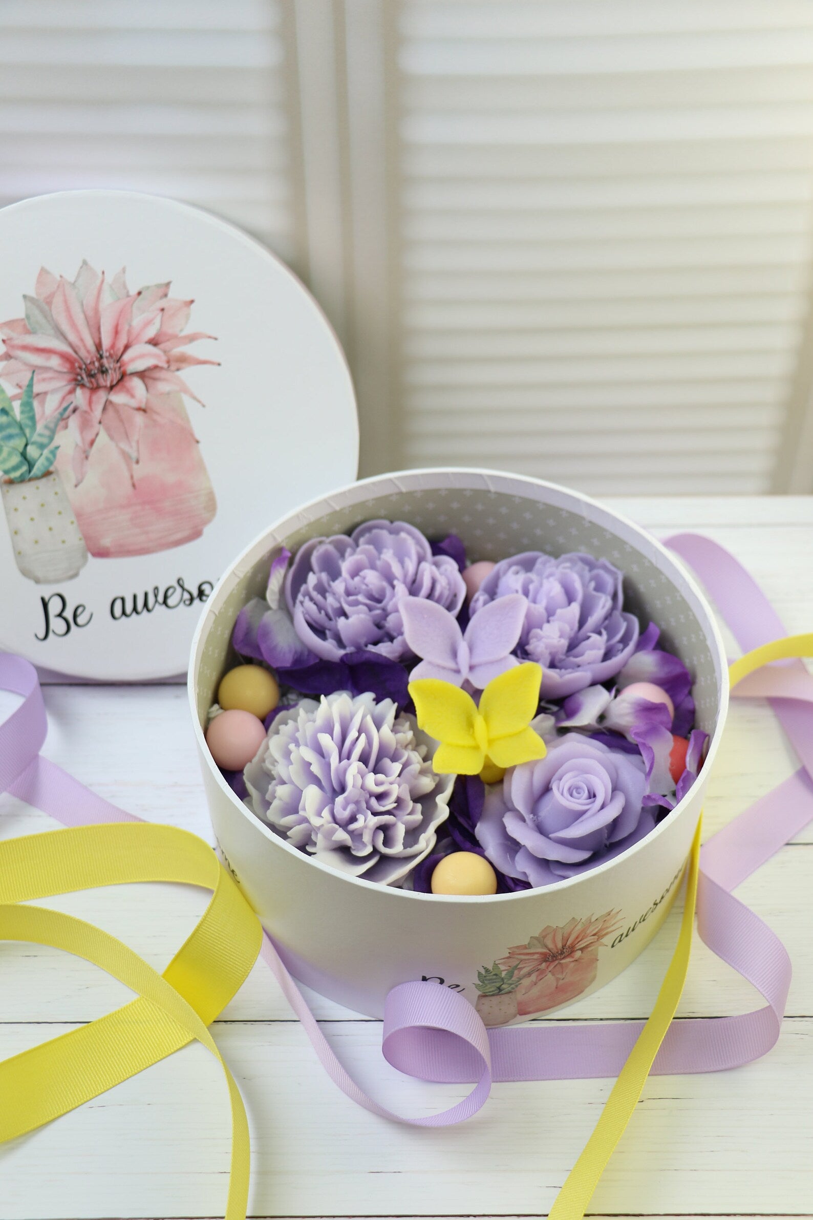 Purple soap flowers in the box with butterflies