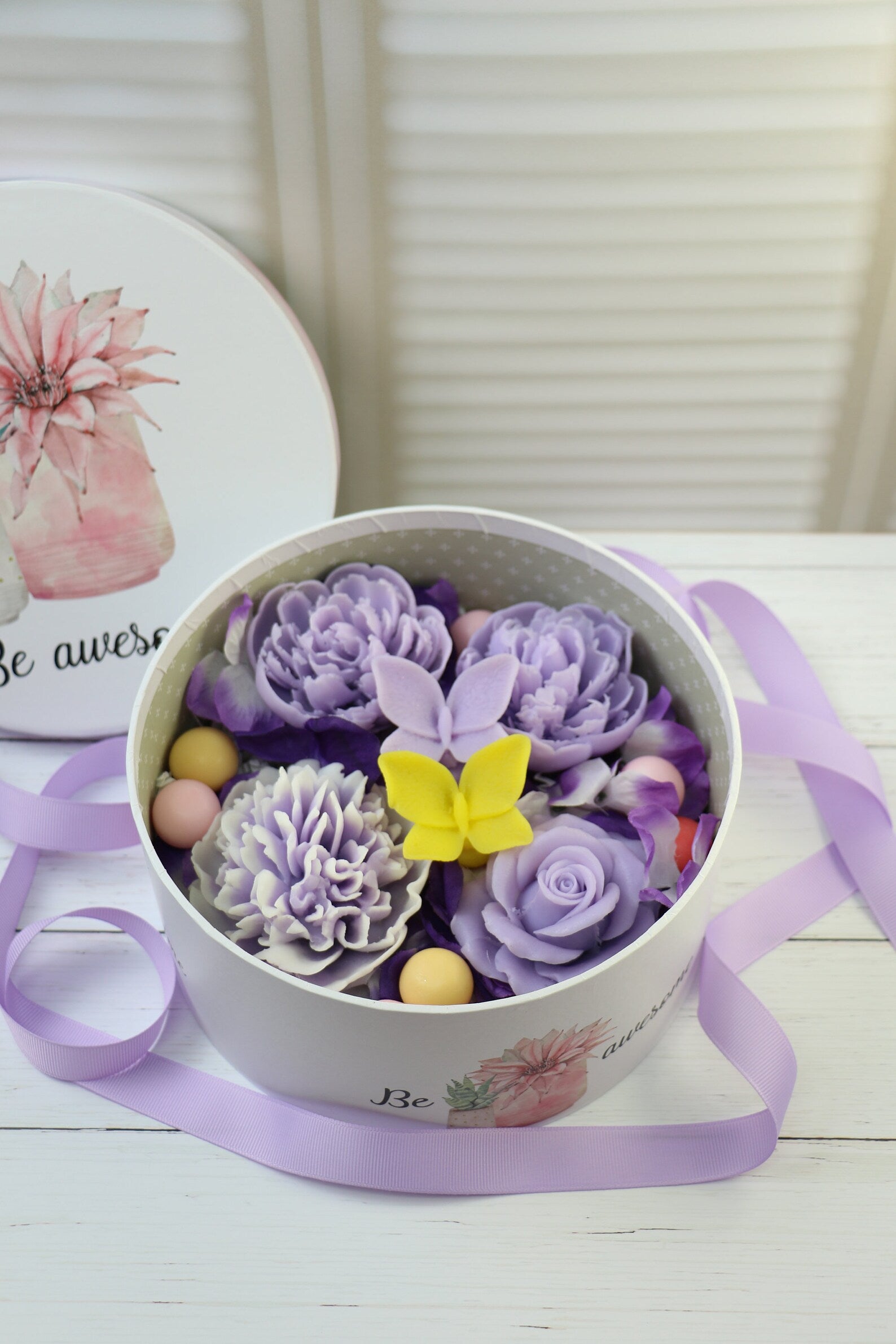 Purple soap flowers in the box with butterflies